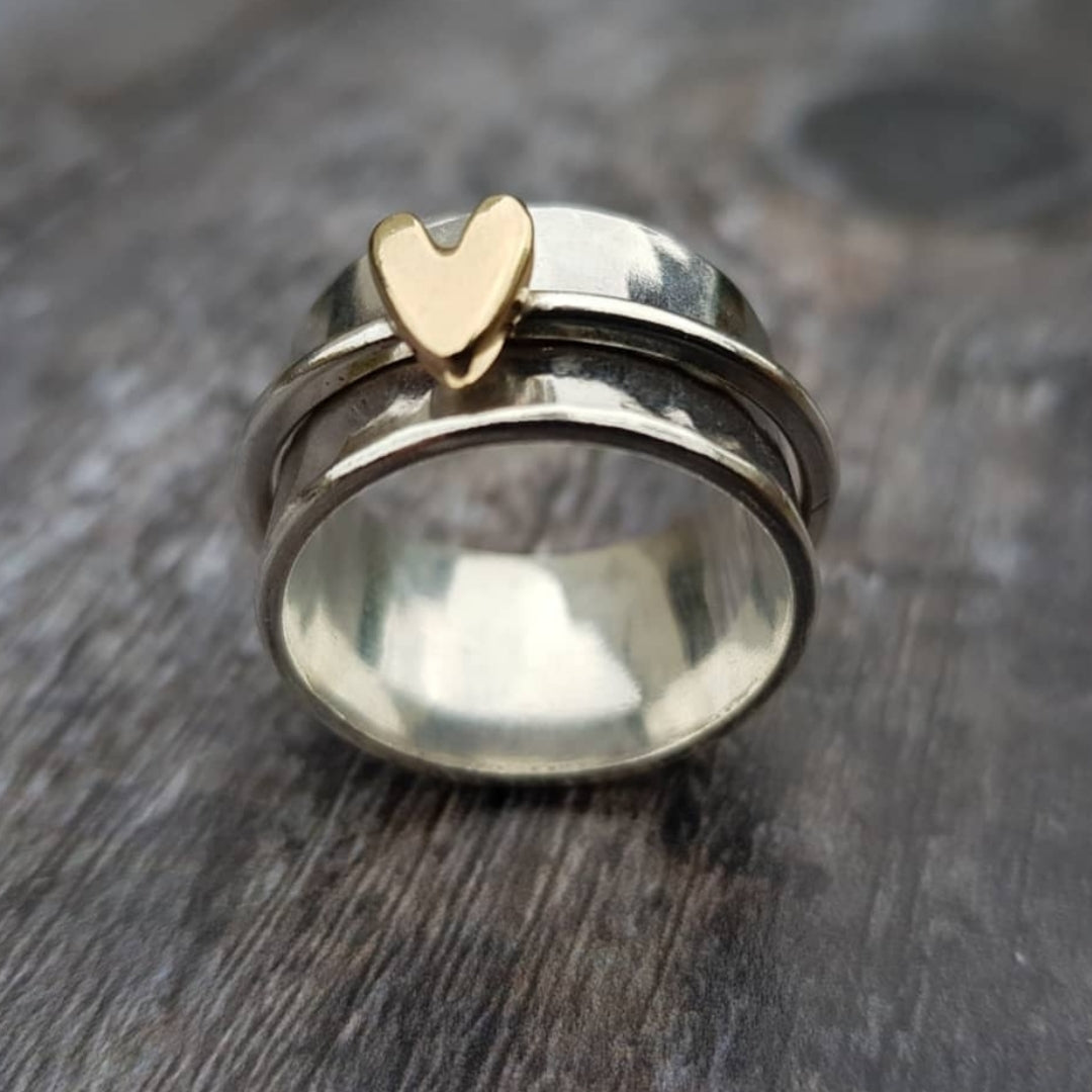 Silver ring with vintage gold heart