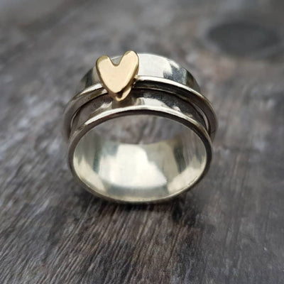 Silver ring with vintage gold heart