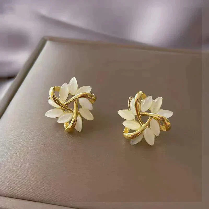 Elegant gold earrings with white opals